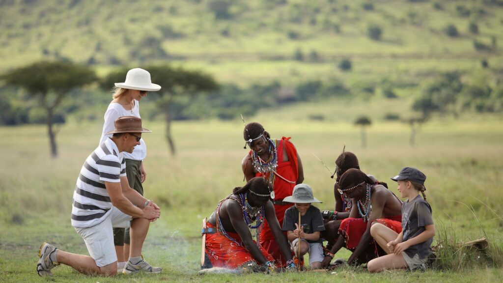 Family on safari in Kenya with maasai